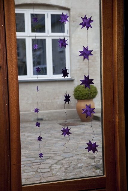 Purple garland with 9 flat folded stars on a purple string S
